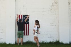 American Flag couples holding baby